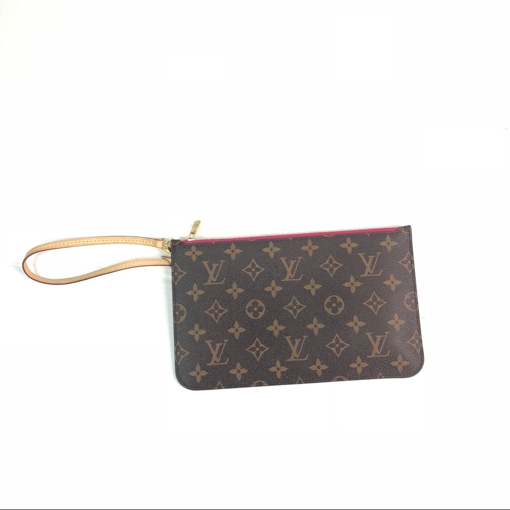 Louis Vuitton monogrammed. Never full wristlet